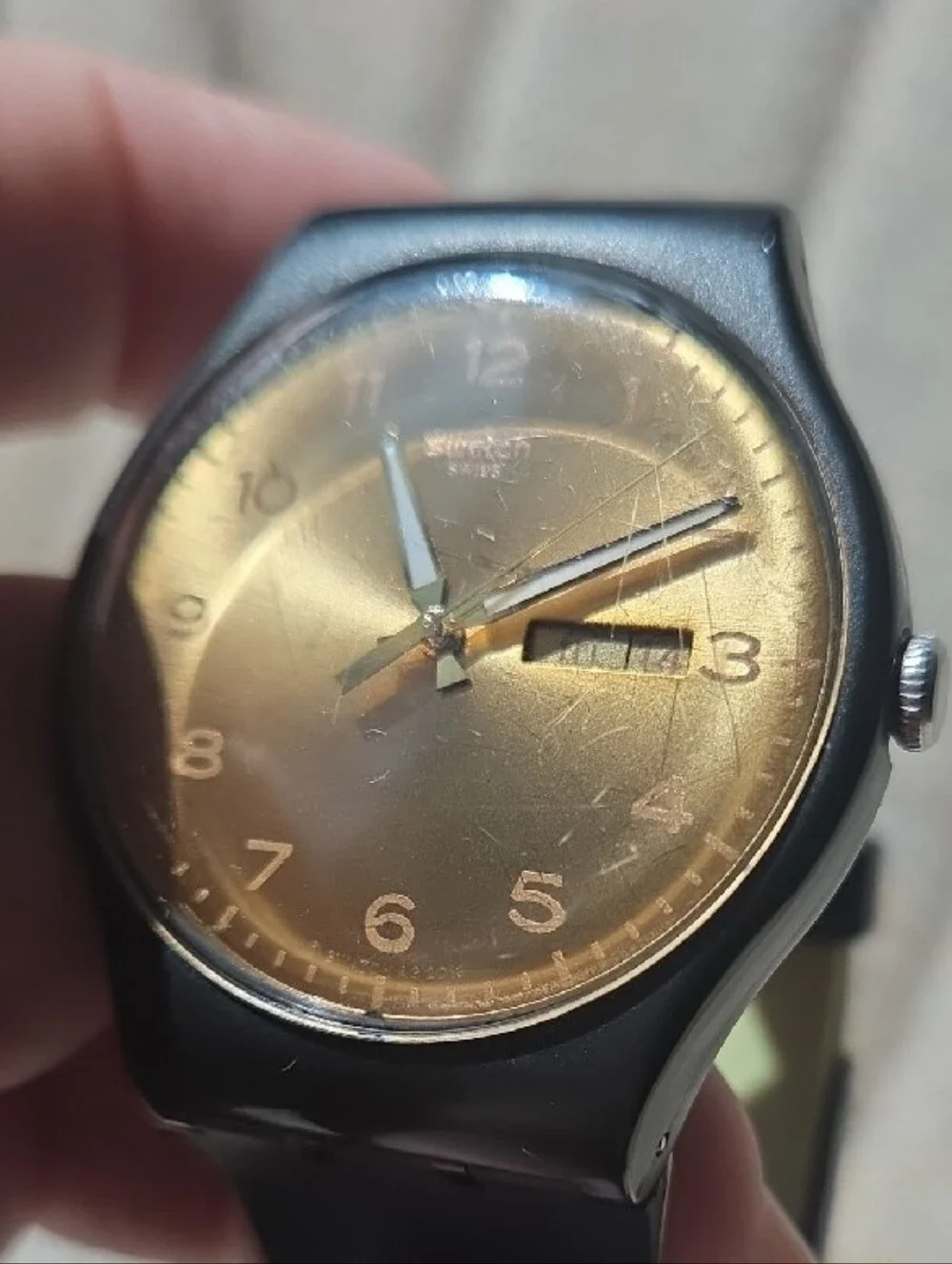 Swatch Black Strap Bronze Dial Analog Watch with Day-Date